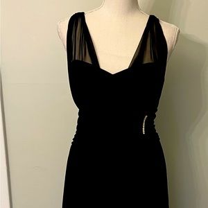 Stunning Grecian inspired black lined dress with rhinestone waist accent.